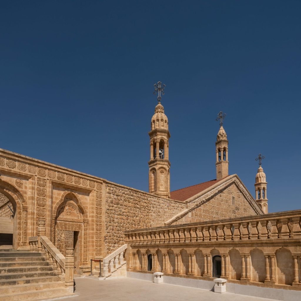 Historic architecture of a Syriac Orthodox Monastery in Midyat, showcasing traditional design.