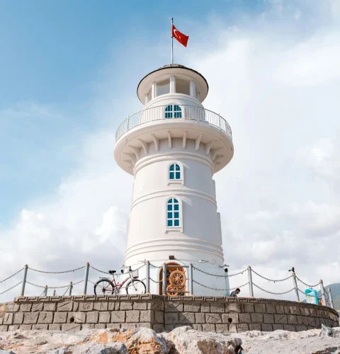 pexels-photo-2563387-2563387 Beautiful lighthouse in Turkey with Turkish flag on a sunny day.