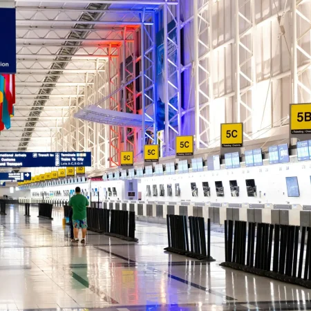 pexels-photo-2574078-2574078 Wide view of Chicago airport terminal showcasing architecture and check-in counters. Flags and signages add vibrant detail.