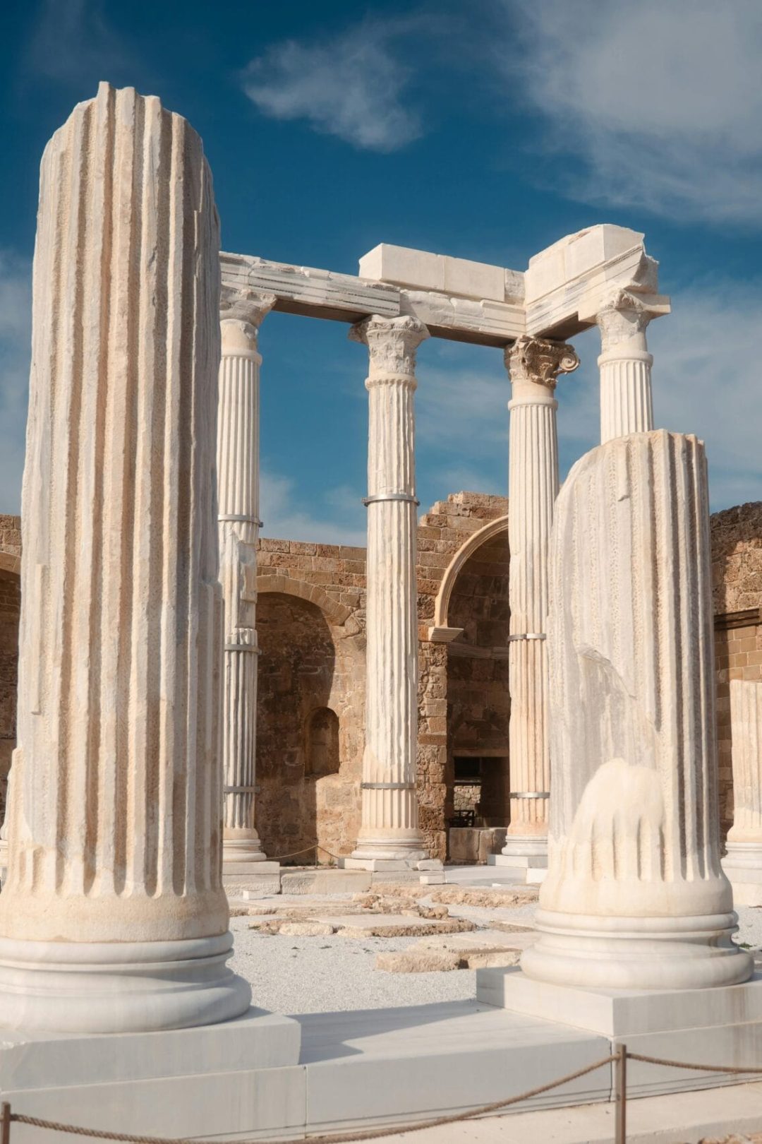 Explore the well-preserved ancient Roman ruins in Side, Antalya, Türkiye, shining under a clear blue sky.