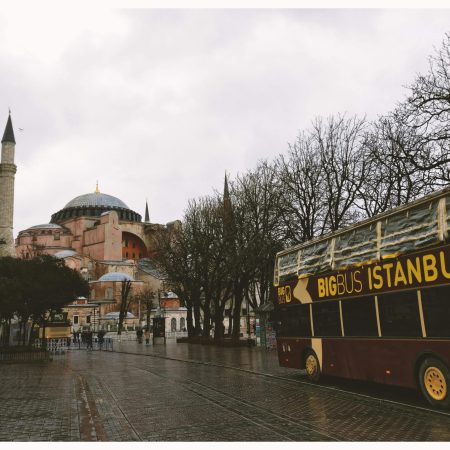 pexels-photo-879478-879478 Scenic view of Hagia Sophia and tourist bus in rainy Istanbul street.